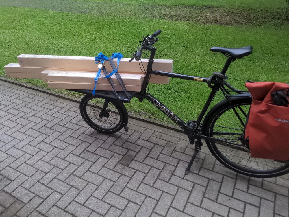 ‘some wooden beams on a cargo bike’
