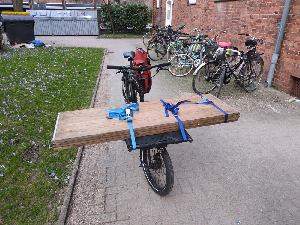 wooden boards on a cargo bike.